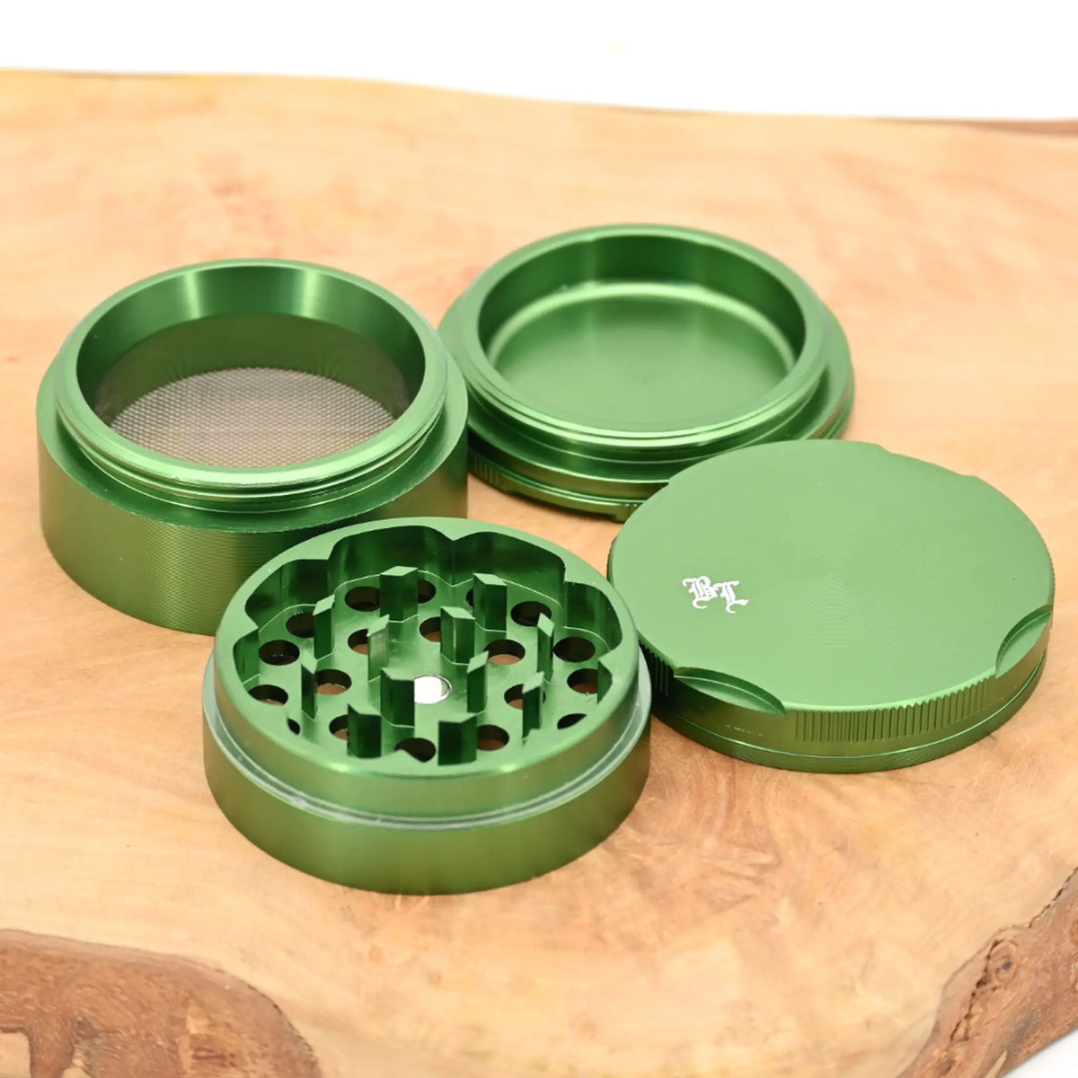 Black-Leaf-New-Edge-Grinder-Dunkelgruen-Grinder-Grinder-4-teilig-Pollensieb-kaufen-Headshop-mit-diskretem-Versand-Johnnys-Headshop